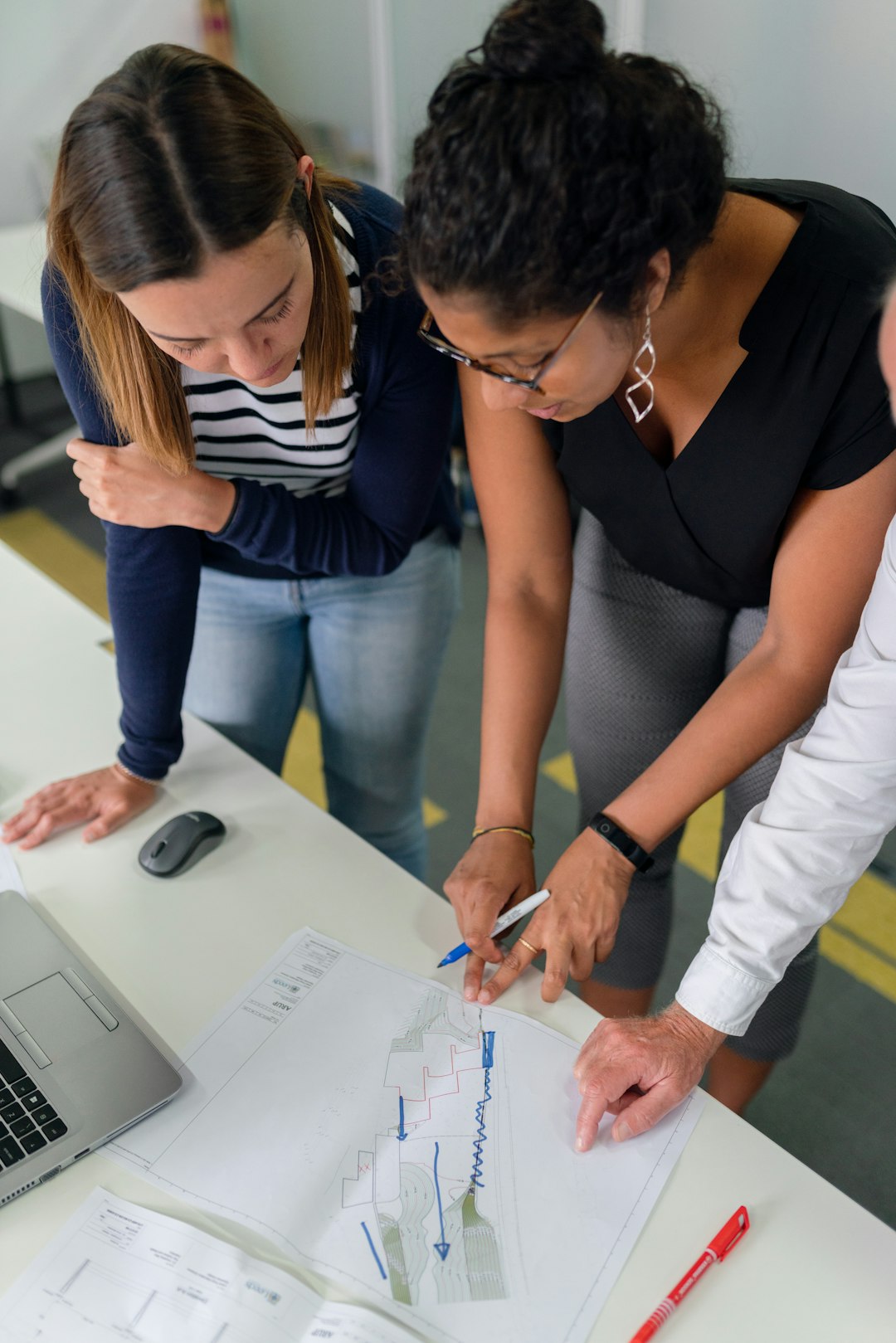 Female civil engineer assesses flood risk management plans